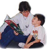 Mom and child read Kelly Bear book